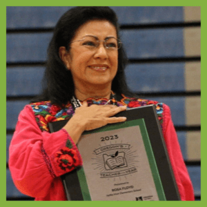 2023 Teacher of the Year Rosa Floyd holding her award