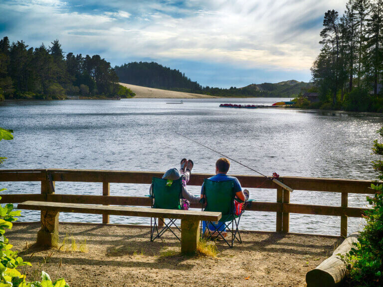 A couple fishing at Honeyman State Park