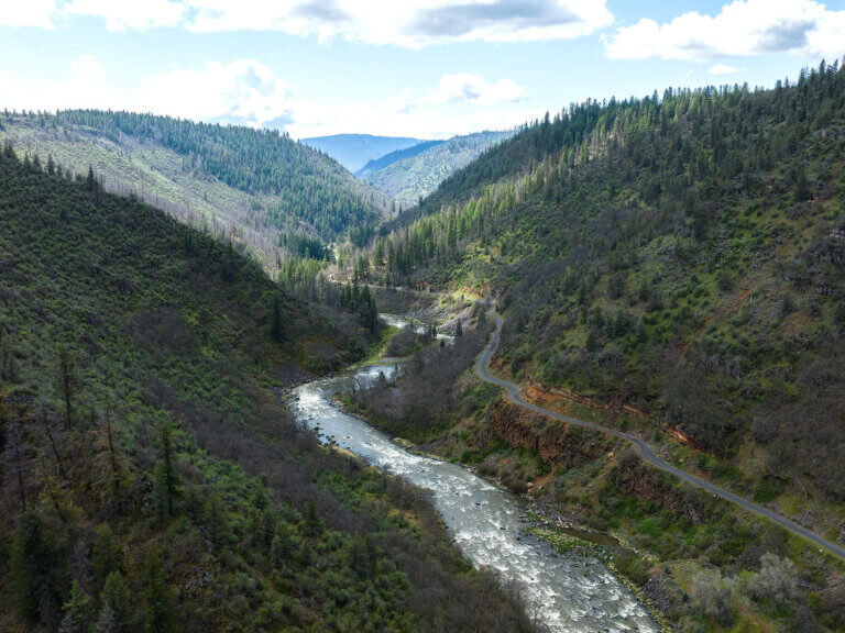 An overhead view of the Klamath river running between mountains